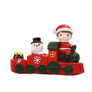 Three-section Christmas train decoration with Santa, snowman and gift boxes on white background