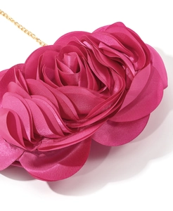 Close-up of rose red satin evening bag with 3D flower petals and gold chain strap