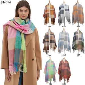 Colorful plaid thick scarf with tassels shown in a variety of vibrant color options