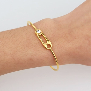 French luxury gold safety pin bangle with clear zircon accents for women