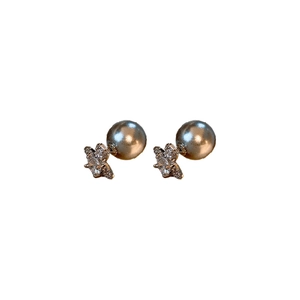 Elegant silver-gray pearl saturn stud earrings with sparkling star cubic zirconia details