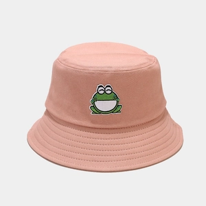 Close-up of pink cotton sun hat featuring cute cartoon frog embroidery and stitched brim