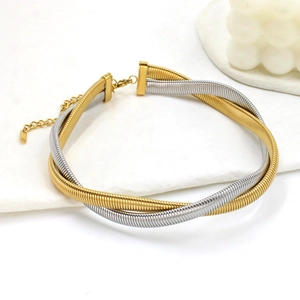 Detail view of dual-tone 8mm titanium steel braided necklace in gold and silver finish