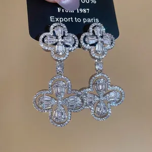 Silver flower drop earrings with sparkling zircon crystals in a double clover design
