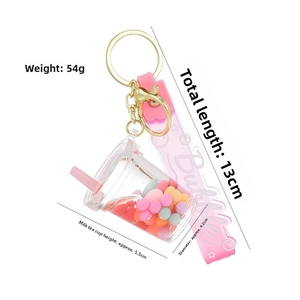 Detailed view of bubble tea keychain with pink strap showing 13cm length and 54g weight