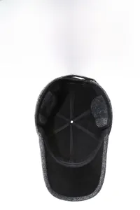 Detail of winter baseball cap with plush fleece lining and foldable ear protection flaps