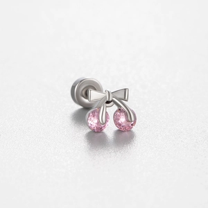 Titanium steel cartilage earring with pink cherry design and bowknot on gray background