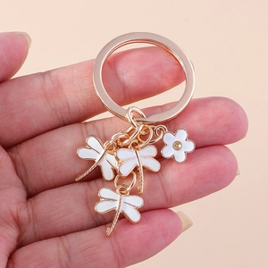 Creative cartoon keychain with three dragonflies and flower charm on gold ring