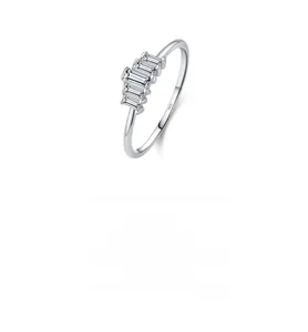 Close-up of S925 sterling silver ring with five baguette-cut crystals and design text