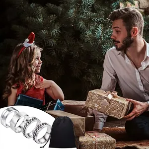4-piece men's stainless steel ring set with spinner chains in a Christmas gift setting