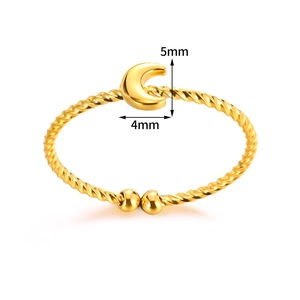 Detail of gold moon open ring featuring a rope textured band and crescent motif