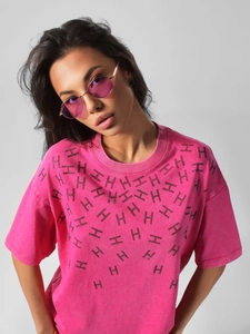 Detail of rose pink washed cotton T-shirt featuring black rhinestone H pattern