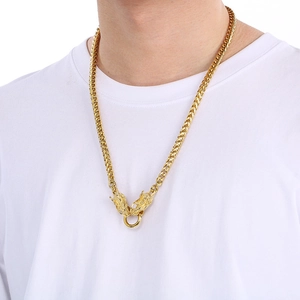 Detail of a vintage punk gold dragon head necklace featuring a square link chain for men