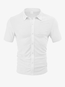 Close-up of white waffle texture knit and herringbone pattern on short sleeve polo shirt