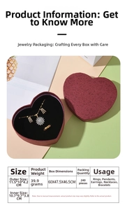 Detail view of heart-shaped burgundy jewelry box with sunflower set and textured surface