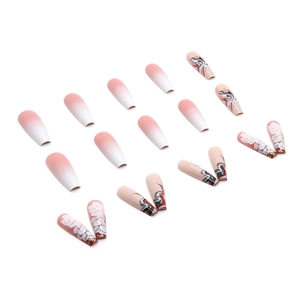 Long coffin fake nails with pink gradient, white floral motifs and abstract ink patterns