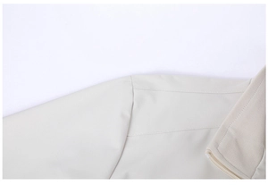 Close-up of the ribbed collar and shoulder stitching on a men's off-white casual jacket