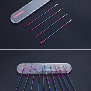 Macro shot of colorful gradient stainless steel blackhead remover tools in a clear case