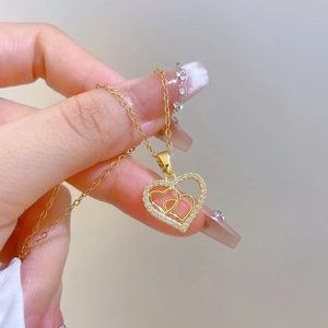 Elegant gold titanium steel heart necklace with cubic zirconia pendant for women