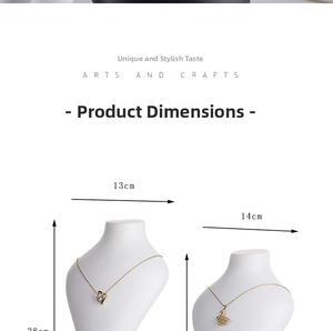 Detail view of heart and swan pendants on white necklace display stand with measurements