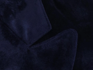 Close-up of premium dark blue velvet blazer collar with refined stitching details