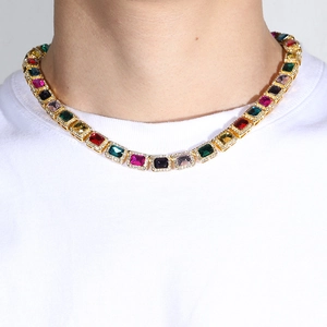 10mm Men's gold Cuban link chain with colorful rectangular zircons worn by a male model