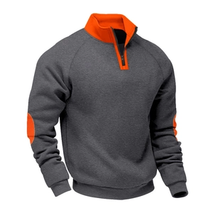 Detail of grey men's quarter-zip sweatshirt with orange elbow patches and knit texture