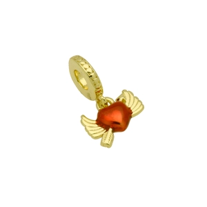 Detailed close-up of a golden heart charm with red enamel wings and cubic zirconia