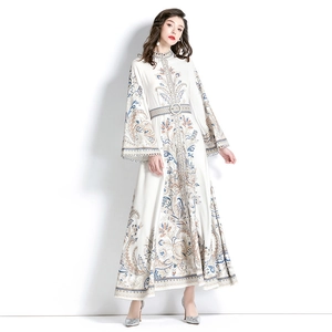 Bohemian paisley print maxi dress with long flare sleeves and matching belt in white