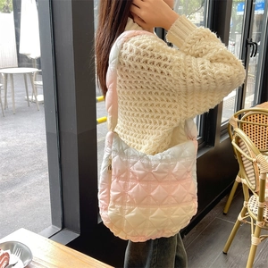 Pink and yellow gradient quilted cloud bag with puffer pleated design and shoulder strap