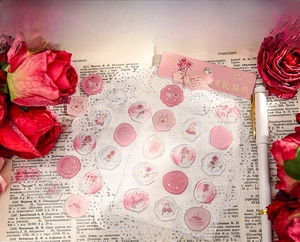 Detail of vintage rose wax seal style embossed stickers with gold foil on old books