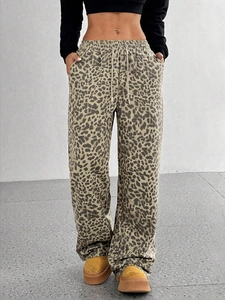 Women high-waisted leopard print trousers with loose wide-leg fit and drawstring