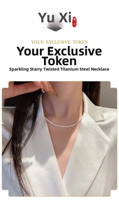 Close-up of sparkling twist titanium steel chain necklace on a model wearing white suit
