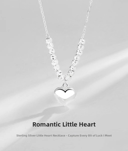 Detailed close-up of S925 sterling silver heart necklace with decorative engraved silver beads