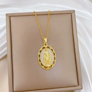Gold hollow oval Virgin Mary pendant necklace with sparkling zircons on silk background
