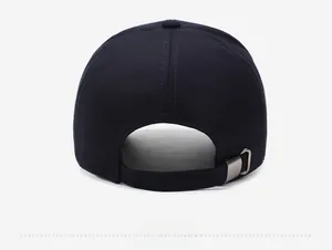 Detail of navy blue cotton baseball cap back with adjustable strap and metal buckle