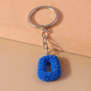 Blue letter O keychain with rose embossed texture and silver metal ring accessory