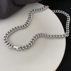 Men's hip hop silver Cuban link chain necklace in stainless steel on display tray