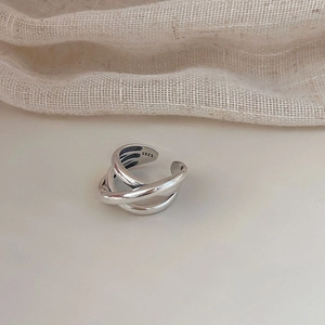 Detail shot of the S925 sterling silver hallmark on the multilayer woven open ring band