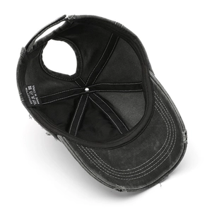 Distressed cotton ponytail baseball cap in washed black with 100% cotton inner tag