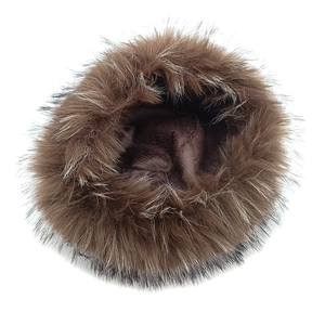 Close-up of fluffy faux mink fur winter hat with thick thermal fleece lining inside