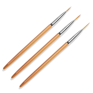 Macro detail of three professional nail art liner brushes with metallic handles