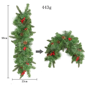 Macro detail of 90cm Christmas pine cone garland with red berries and flexible pine needles
