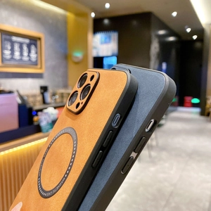 Detail of orange leather and blue matte iPhone cases with built-in MagSafe magnetic rings