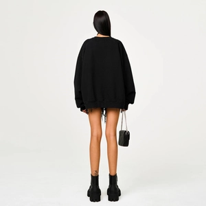 Oversized black cotton hoodie with cross design seen from a minimalist back perspective