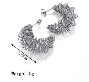 Detailed view of silver spring coil hoop earrings with 2.85cm size and 5g weight