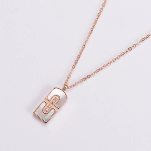 Elegant rose gold necklace with rectangular shell pendant and diamond accents