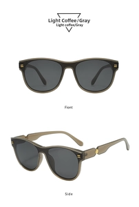 Detail view of light coffee oval sunglasses with gray lenses and metallic side accents