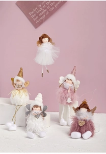 Detailed view of five plush angel ornaments with glitter wings and tulle skirts