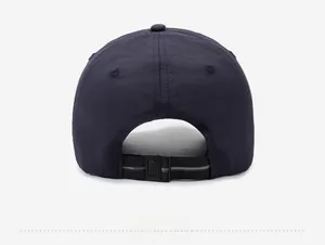 Detail view of the adjustable rear strap and plastic buckle on a navy blue sun hat